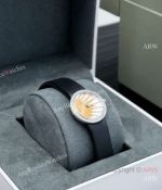 High Quality Replica DIOR LA D DE DIOR ROSE CÉLESTE Black Silicone Strap Gold-Carved Sun With Nine Rays Pearl Mother-of-pearl Face Dial Diamond-Inlaid Silver-Tone Case Watch 25mm